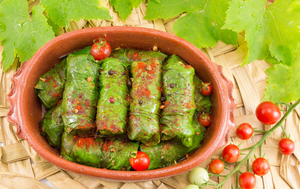 Sarma rolls in a traditional plate and cherry tomato - Photo, Image