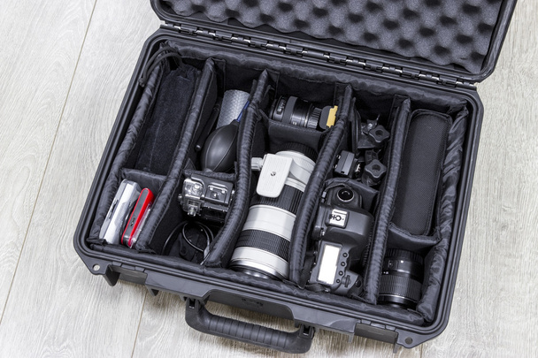 Photo equipments arranged inside of the protector case - Фото, изображение