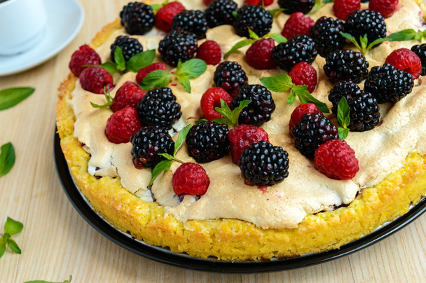Pie (Tart) with fresh blackberries and raspberries, air meringue, decorative mint. - Photo, Image