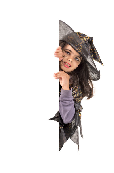 girl wearing Halloween witch costume - Fotó, kép