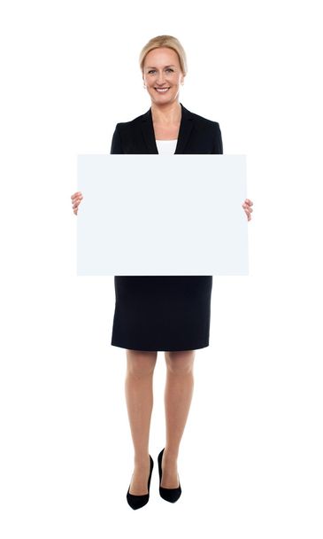 Businesswoman showing blank white billboard - Foto, afbeelding