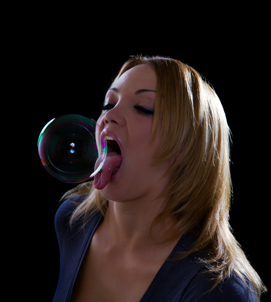 Sexy woman licking soap bubble - Foto, immagini
