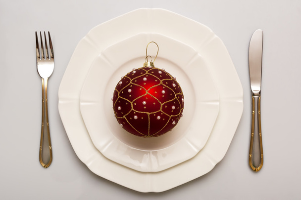 Plate and cutlery. Christmas ball. - Photo, Image