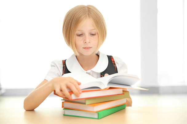 Smiling girl with many books  - Foto, Bild