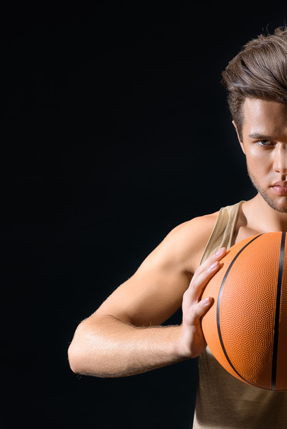 Confident male athlete playing basketball - Фото, изображение