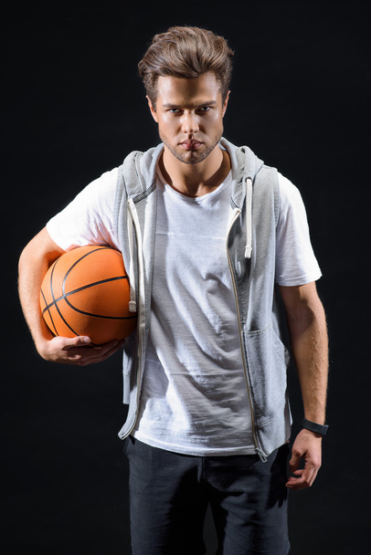 Skillful basketball player posing with confidence - Valokuva, kuva