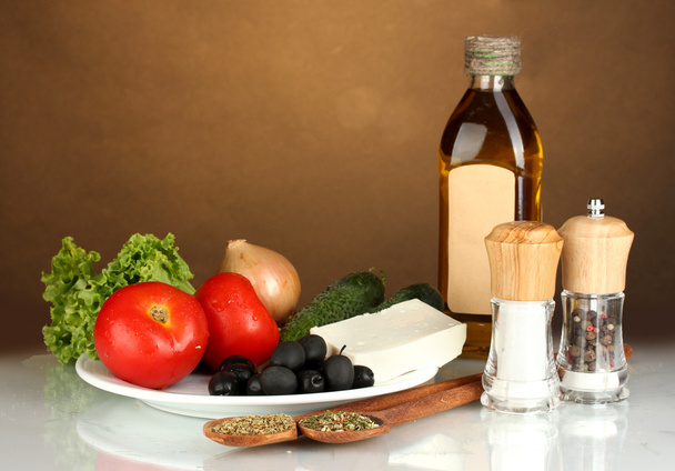 Ingredients for a Greek salad on brown background close-up - Foto, Imagen