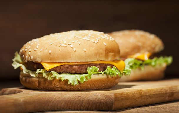 Fresh burgers on wooden background - Fotoğraf, Görsel