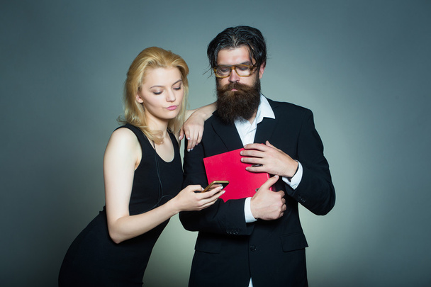 Serious couple look in smartphone - Фото, зображення