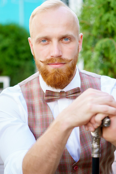 Portrait of stylish blonde man with red beard - 写真・画像