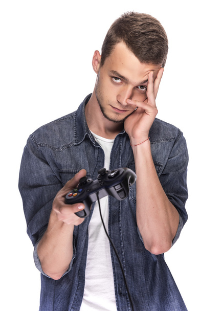 Young man playing on console or computer. - Foto, Imagen