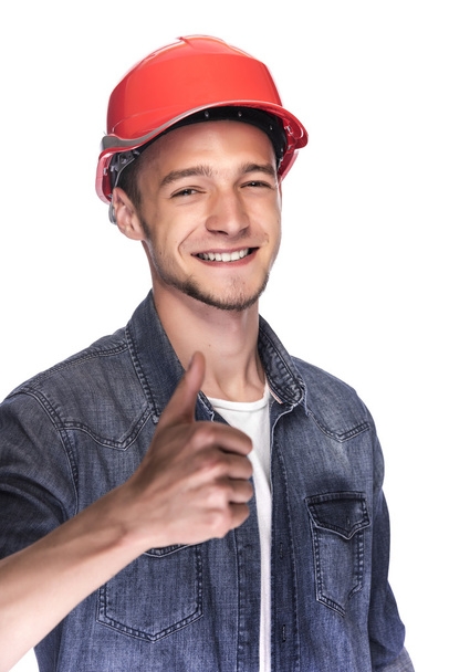 Young man in a construction helmet. - Fotografie, Obrázek
