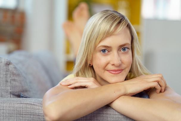 Close up of woman relaxing on sofa chair indoors - Φωτογραφία, εικόνα