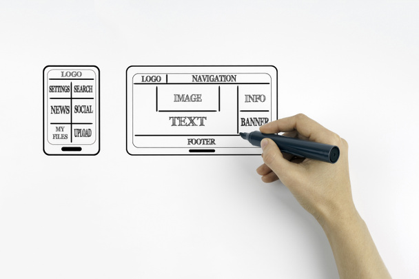 Рука с маркером написания сайта и разработка мобильных приложений
 - Фото, изображение