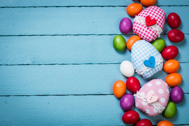 easter concept with colorful handmade eggs and rabbit on wooden table - Foto, Imagen