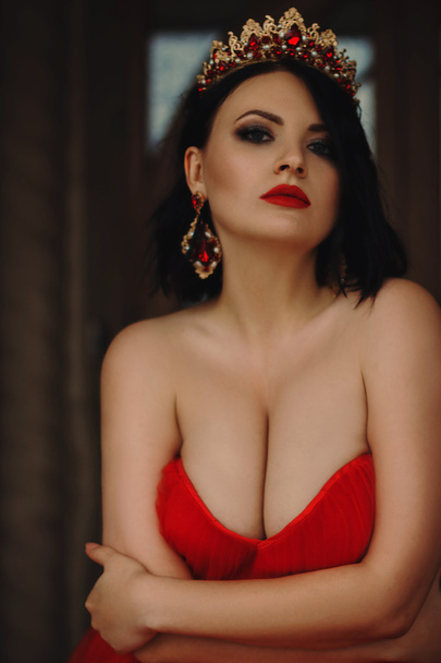Gorgeous woman in red dress with crown - Photo, Image