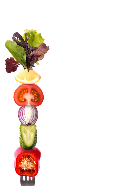 Fresh mixed vegetables on fork .healthy food - Photo, image