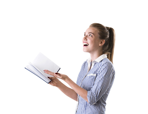 Girl in striped shirt with book - Foto, afbeelding
