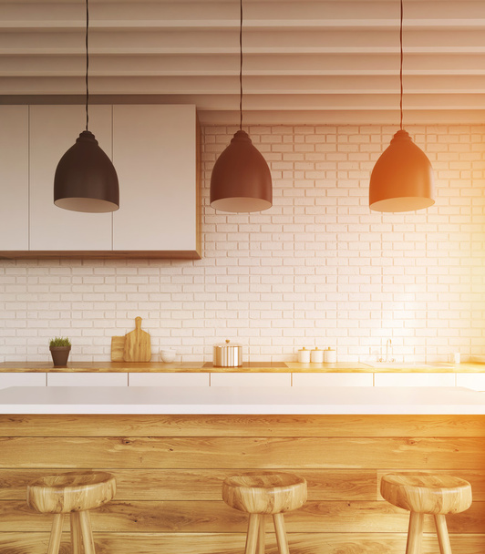 Bar counter in kitchen with stools, brick walls, cupboard and ceiling light. Concept of home food. 3d rendering. Toned image - 写真・画像