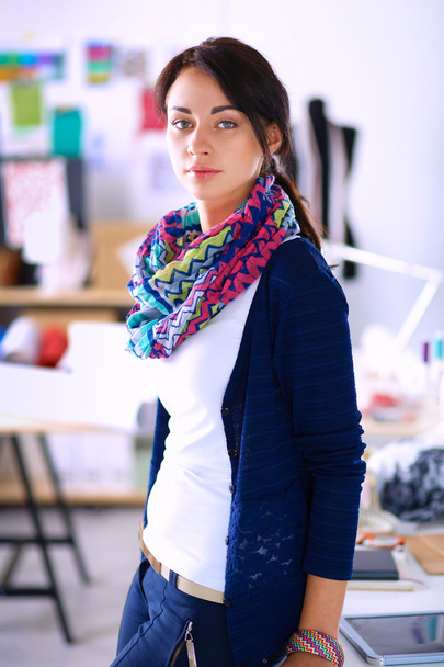Beautiful fashion designer standing in studio - Foto, Imagen