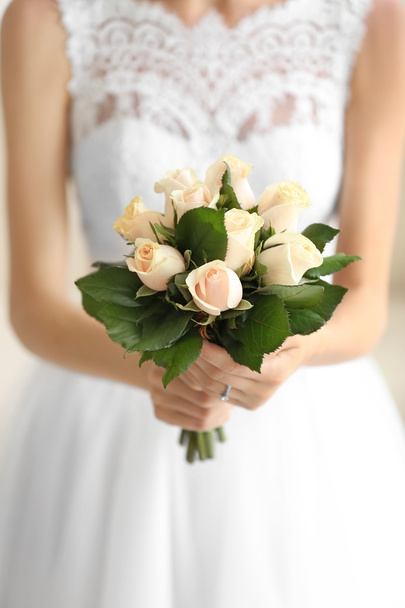 Bride holding wedding bouquet - Фото, зображення
