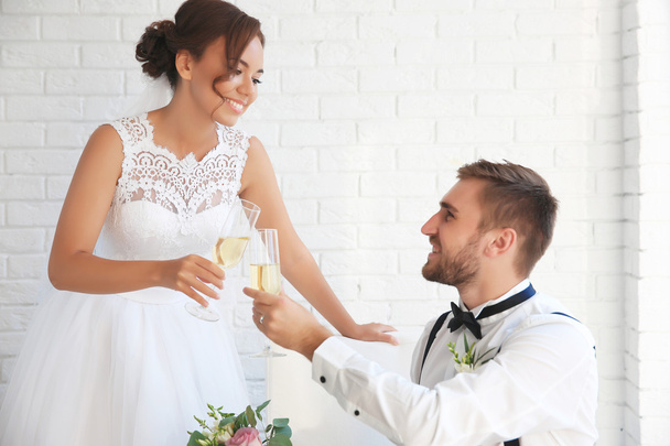 Groom and bride with glasses of champagne  - Foto, Imagen