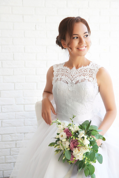 Beautiful bride with wedding bouquet  - Fotó, kép