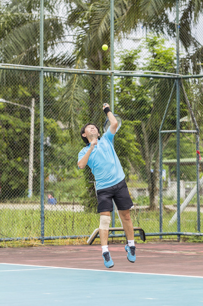 Tennis player in action - Foto, Imagen