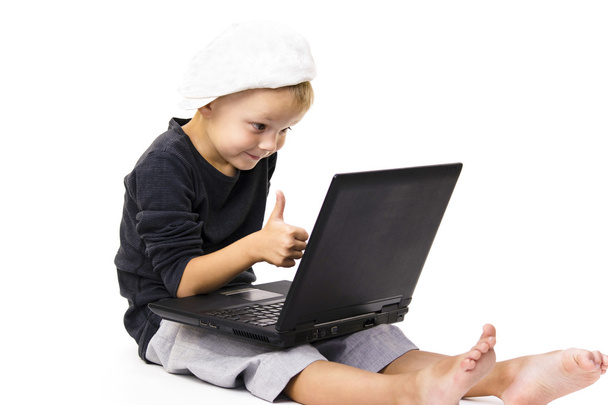 cute boy playing laptop - Fotó, kép