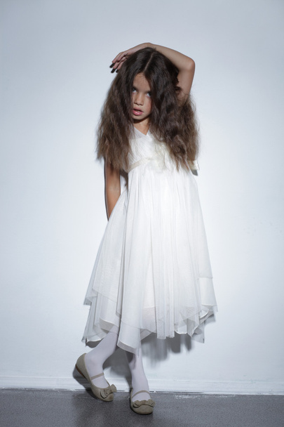 Portrait of pretty little girl in white dress - Fotografie, Obrázek