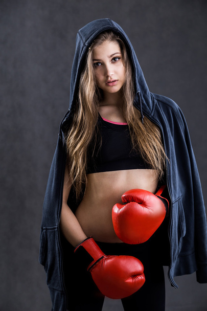 Woman boxer in hoodie - Фото, зображення