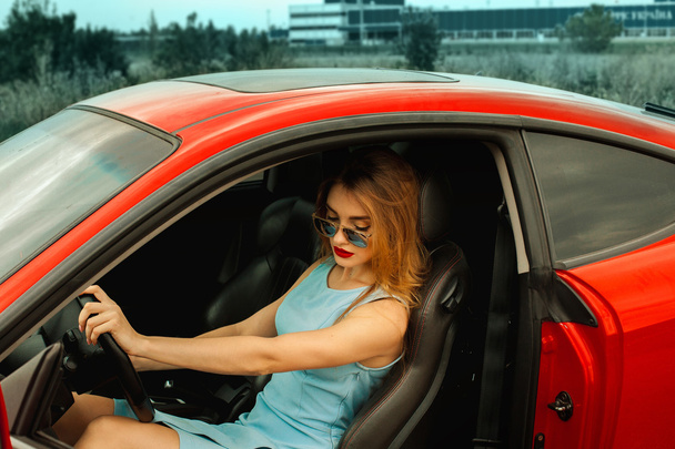 beauty woman in red car - Foto, imagen
