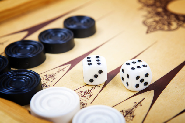 Game field in a backgammon with cubes and counters. - Photo, Image