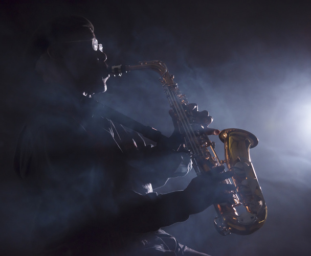 Musician playing saxophone - Фото, зображення