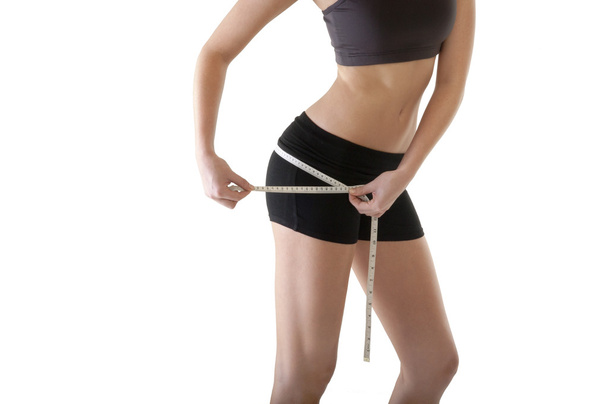 Vrouw controleren voor weight loss  - Foto, afbeelding