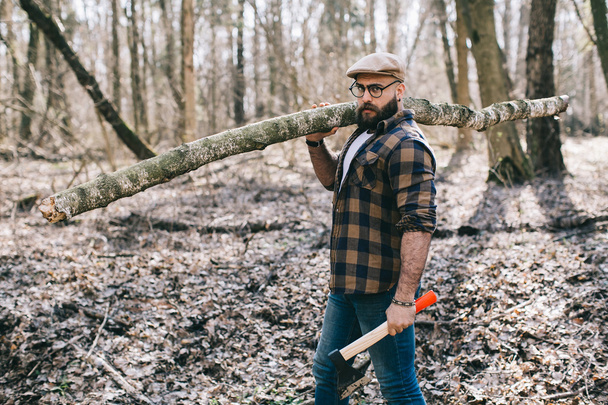 Bearded lumberjack in the wood - Fotó, kép