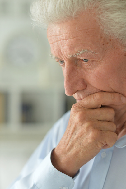 Sad senior man at home - Фото, изображение