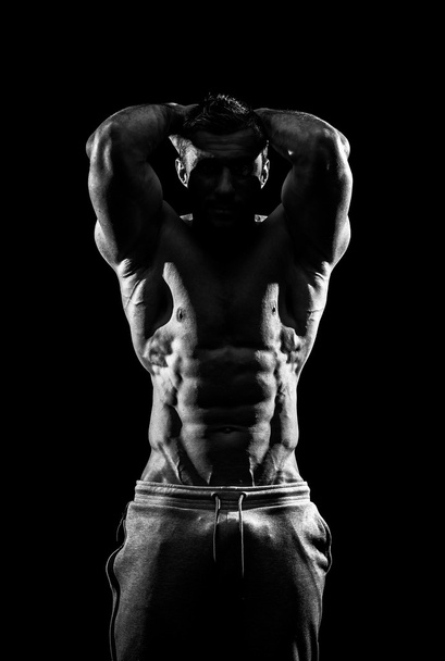 bodybuilder, posing on black - Foto, Imagem