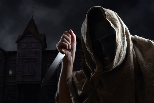  hooded man in mask with a knife - Photo, Image