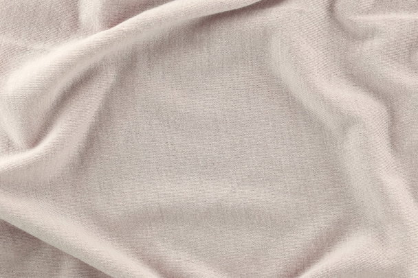 Крупный план рифленой хлопчатобумажной ткани кремового цвета
. - Фото, изображение