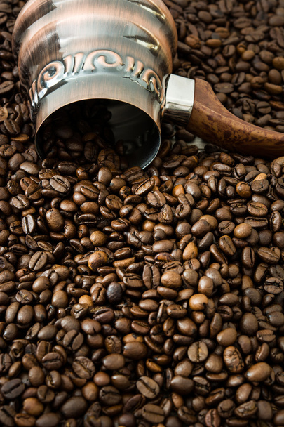 Turkish coffee pot on coffee beans background - Foto, immagini