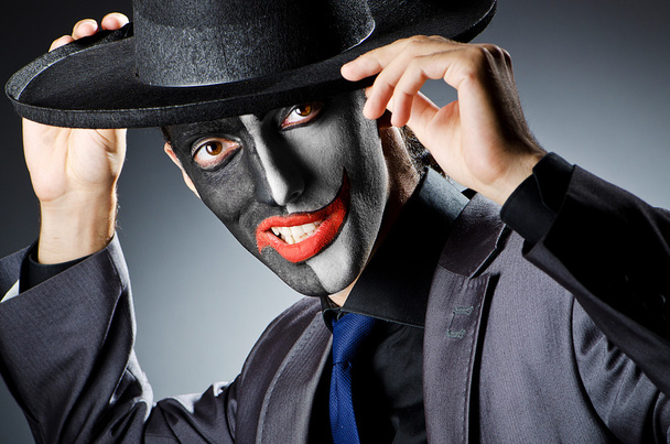 Homme d'affaires avec peinture visage de clown
 - Photo, image