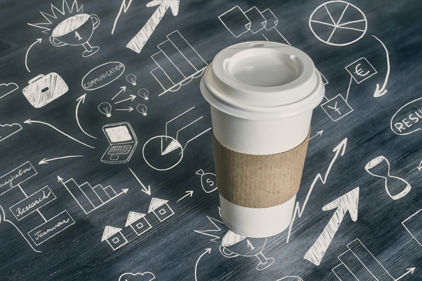 Coffee cup with business drawings - Φωτογραφία, εικόνα
