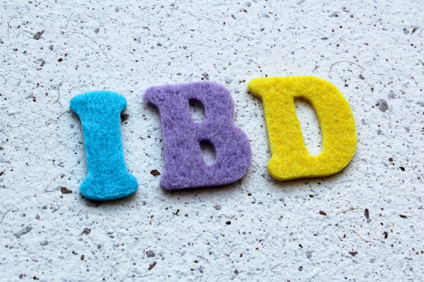 IBD (malattia infiammatoria intestinale) acronimo su tessitura di carta fatta a mano
 - Foto, immagini