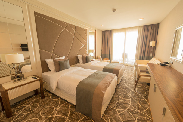 Modern hotel room with big bed - Φωτογραφία, εικόνα