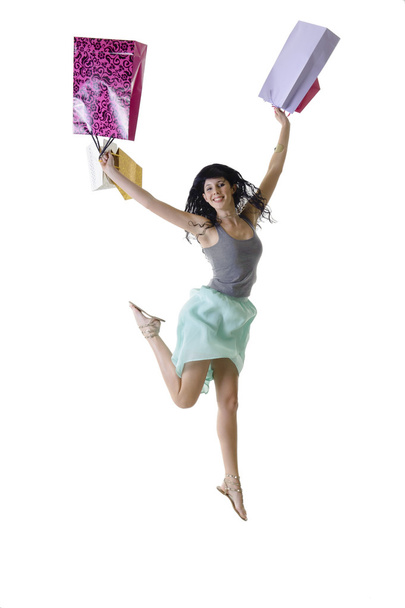  shopaholic jumping with shopping bags - Photo, image