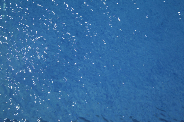 Фон волнистого рисунка чистой воды в голубом плавании
 - Фото, изображение