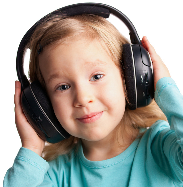 Little girl in headphones - Фото, изображение