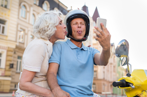 Mature couple showing tongues. - Photo, Image
