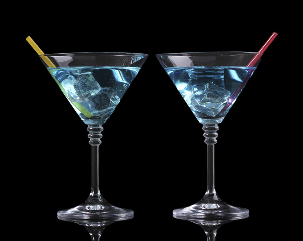 Blue cocktail in martini glasses isolated on black - Photo, Image